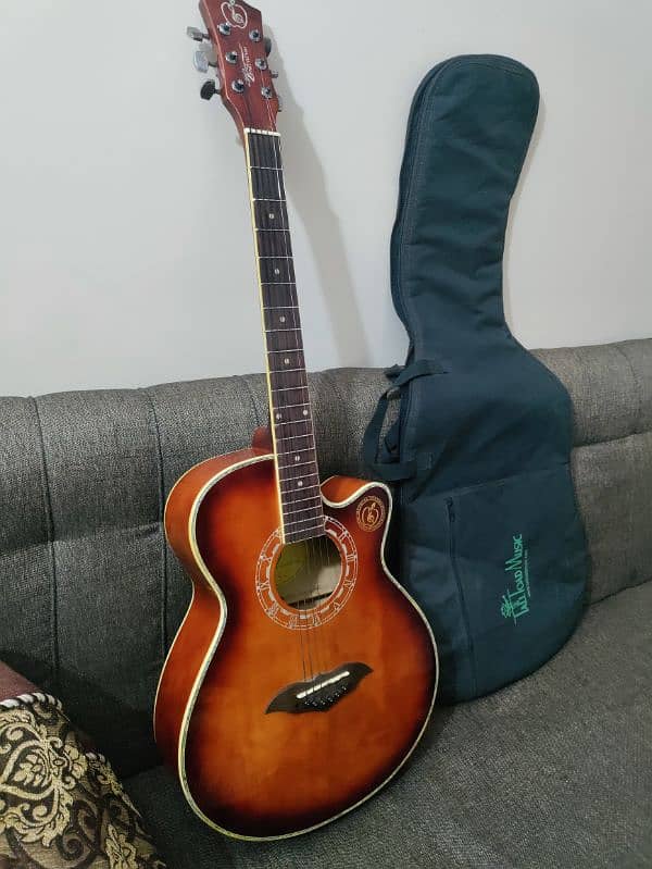 Acoustic guitar with bag,capo and picks 10