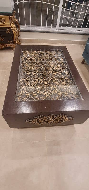 Wooden engraved centre table with glass 0