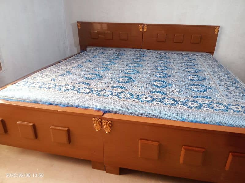 2 wooden single beds 1