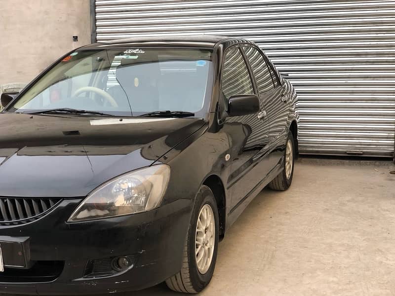 Mitsubishi Lancer total genuine2004/5 btr thn city corollaalto wagonr 1