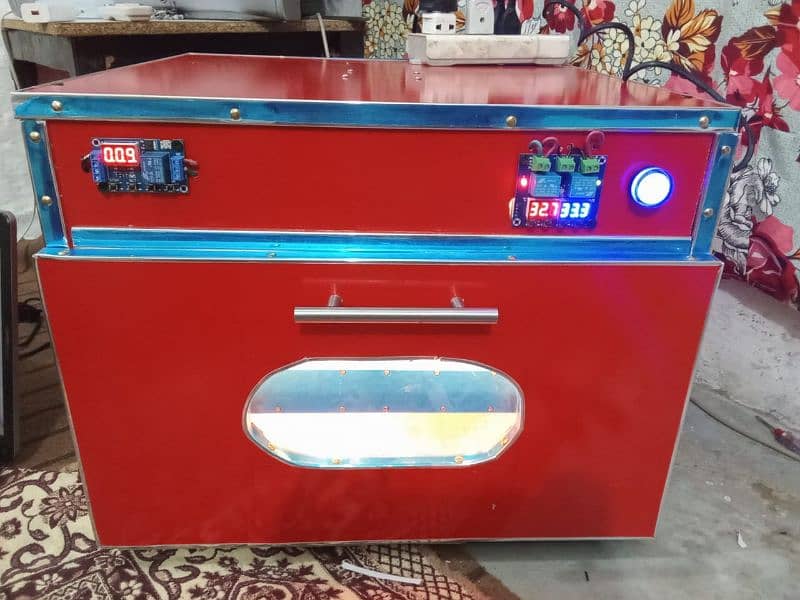 انڈوں سے چوزے نکا لنے والی مشین Eggs Hatching incubator AC and DC 11