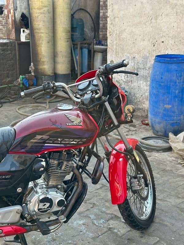 honda deluxe 125  red colour kick start  brand new condition 4