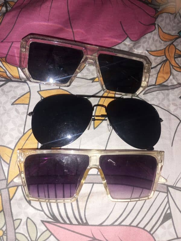 pack of three sunglasses new condition colour black purple 3