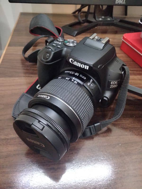 Canon 250D with 18-55mm lens 0