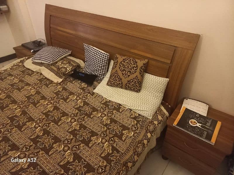 king size bed with 2 side tables and 2 door almari 2