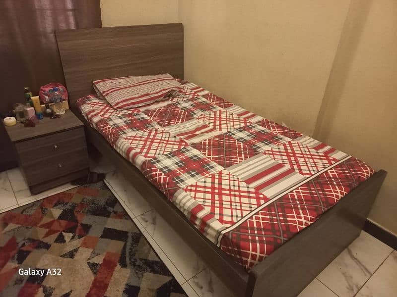 2 single bed with mattess and side table 0