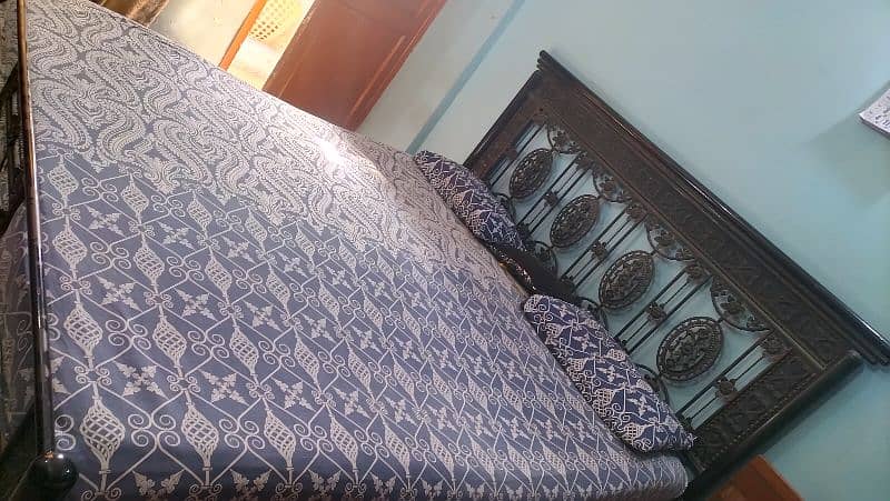 Iron rod bed with mattress 0