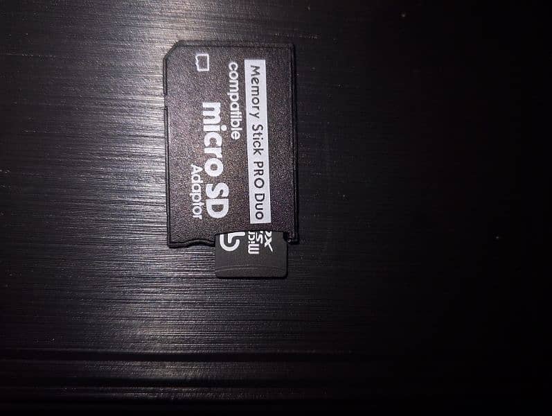 psp memory card adapter with and without memory card available. 2