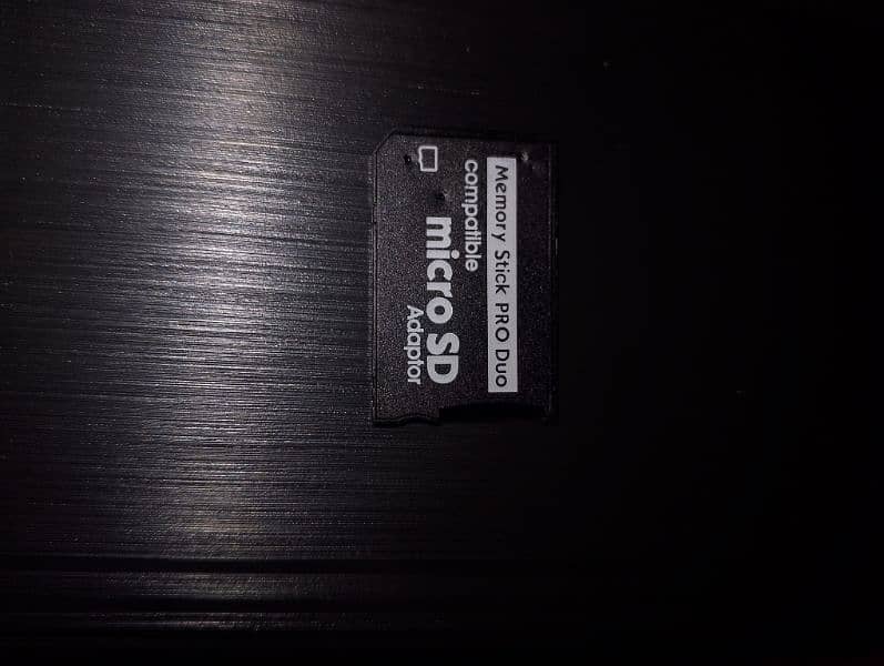 psp memory card adapter with and without memory card available. 4