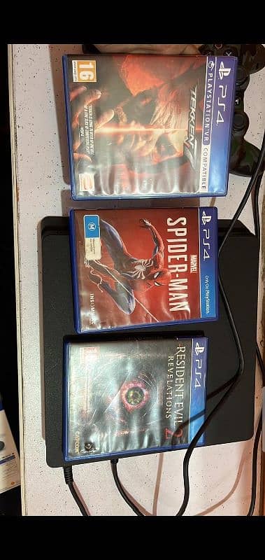 PS4 slim with 9 Games and box 1