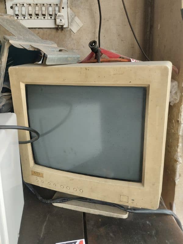 CRT monitor and old antique piece 0