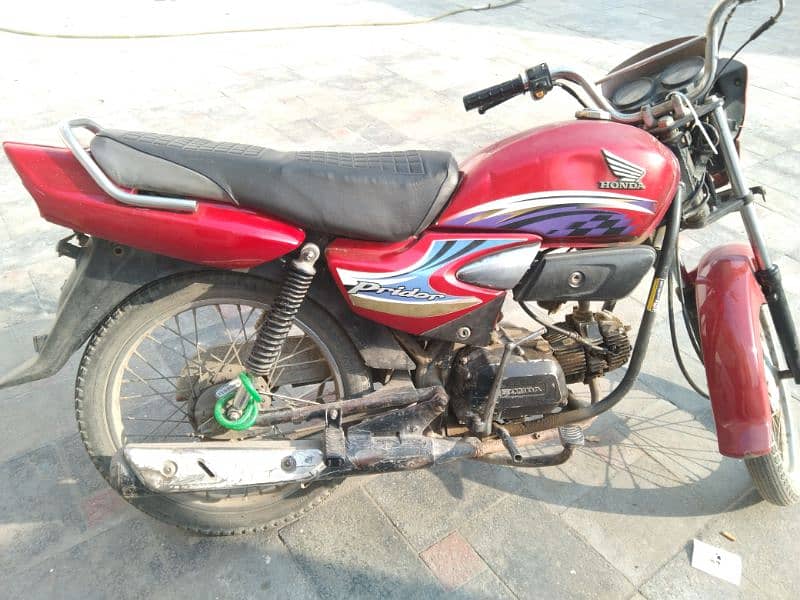 Honda 100 2014 model urgent sale lahore 2