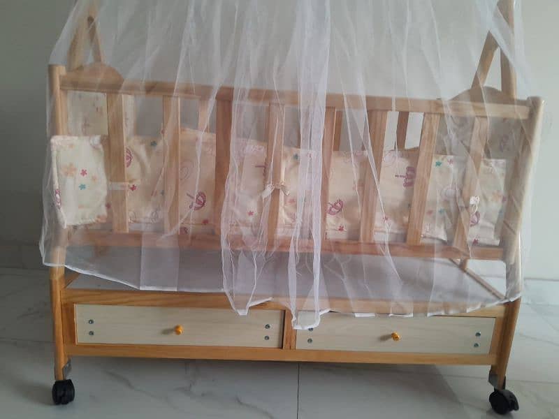 wooden baby cot with drawers. . . 1