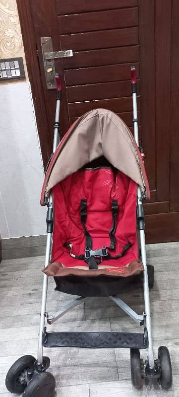 Junior Brand Imported backspin stroller with umbrella cover. 2