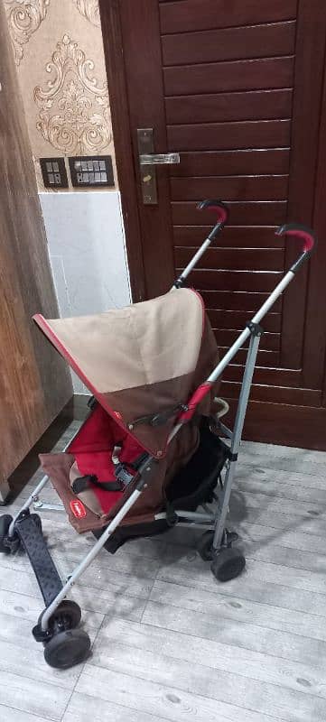 Junior Brand Imported backspin stroller with umbrella cover. 3