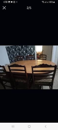 wooden table and 6 chairs