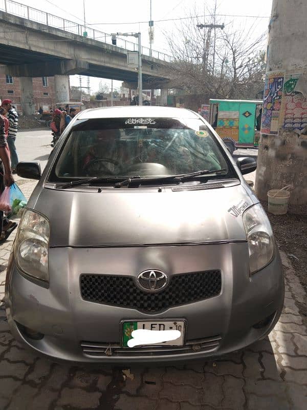 Toyota Vitz 2007 silver Lahore number bumper to bumper janin car 1