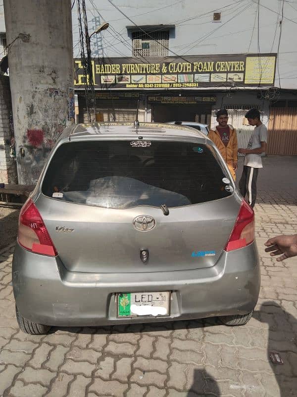 Toyota Vitz 2007 silver Lahore number bumper to bumper janin car 19