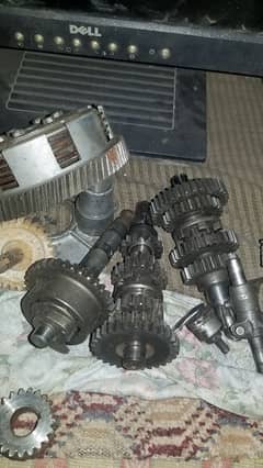 engine suzuki 100 ,alloy rims ,fuel tank, rx 115 shoks