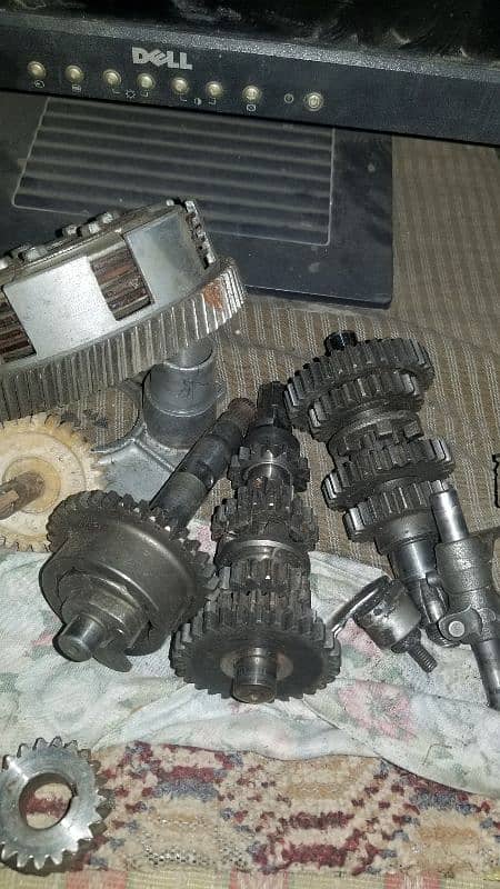 engine suzuki 100 ,alloy rims ,fuel tank, rx 115 shoks 0