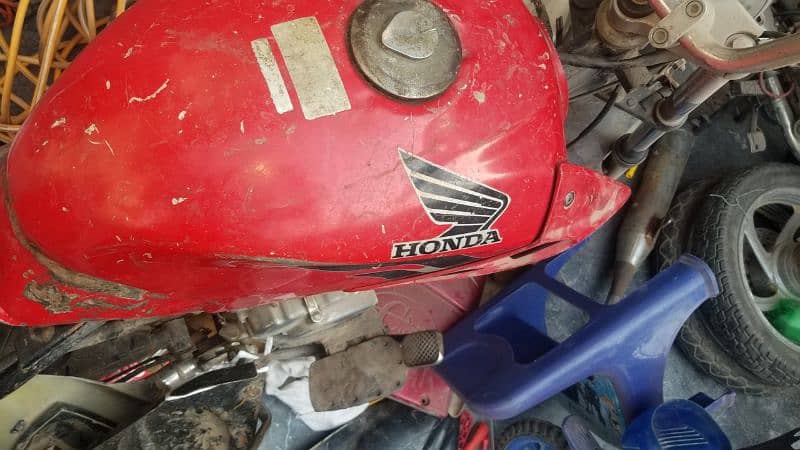 engine suzuki 100 ,alloy rims ,fuel tank, rx 115 shoks 6