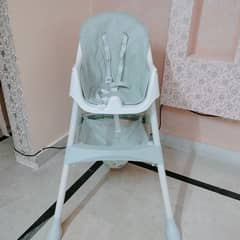 Gently used baby chair for sale.