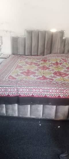 bed with looking mirror side table