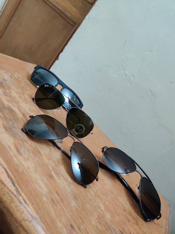 Sunglasses Ray ban and Prada Company 1