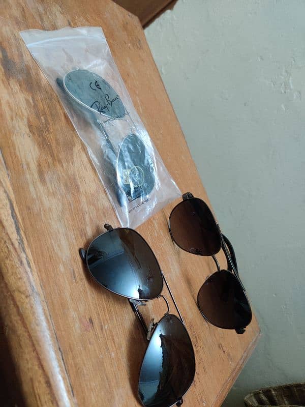 Sunglasses Ray ban and Prada Company 7