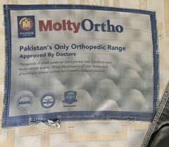 Bed and MoltyOrtho Mattress with mattress protector