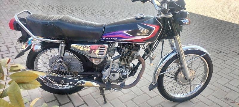 Honda 125 bike golden number 2