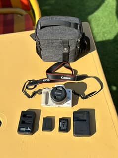 canon eos m50 (just 3-4 times used) with 2 batteries, no 2 chargers,)