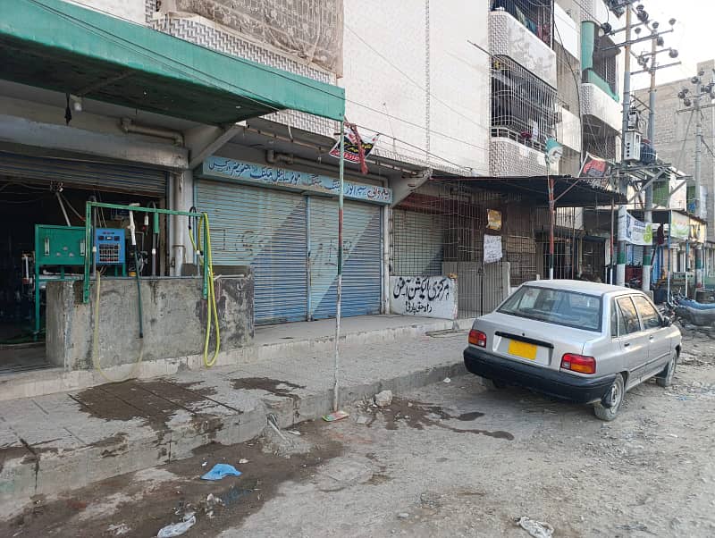 Commercial located shop for sale at prime location of surjani town T facing 1