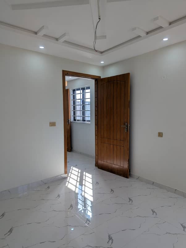 5 Marla house Located in the prestigious Nasheman Iqbal Phase 2, Block A-2, this stunning, brand new property offers a luxurious and contemporary living experience 1