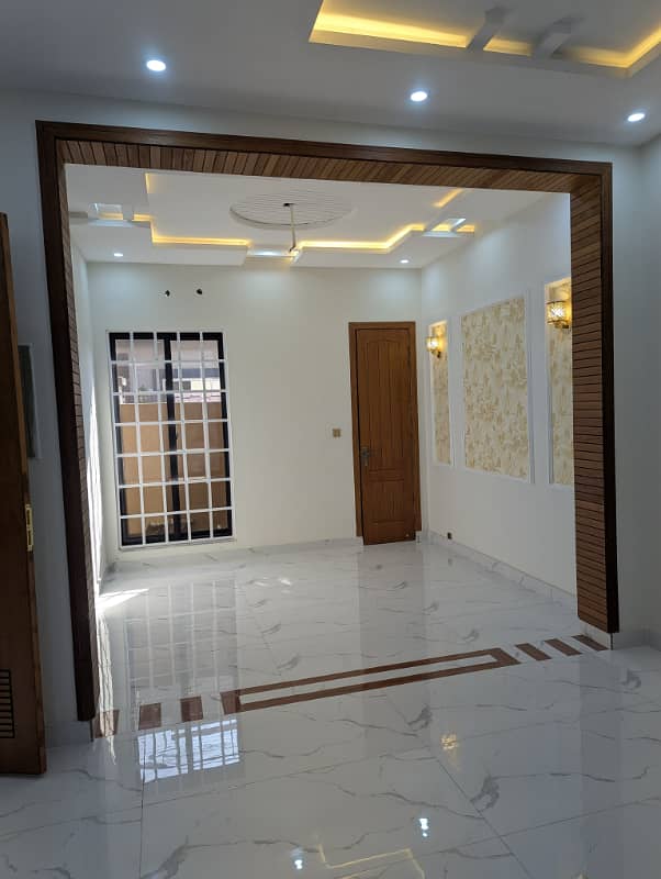 5 Marla house Located in the prestigious Nasheman Iqbal Phase 2, Block A-2, this stunning, brand new property offers a luxurious and contemporary living experience 30