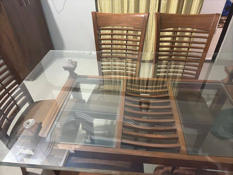 a Square 6  chair Dining Table Made up of Wood and Glass 0