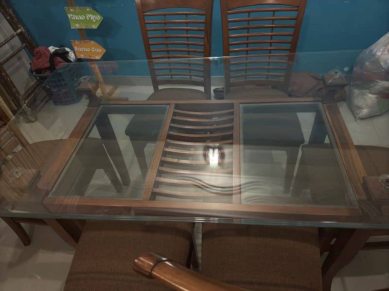 a Square 6  chair Dining Table Made up of Wood and Glass 1