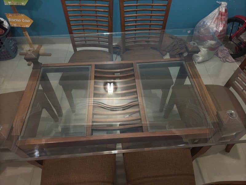 a Square 6  chair Dining Table Made up of Wood and Glass 2