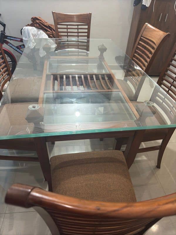 a Square 6  chair Dining Table Made up of Wood and Glass 3