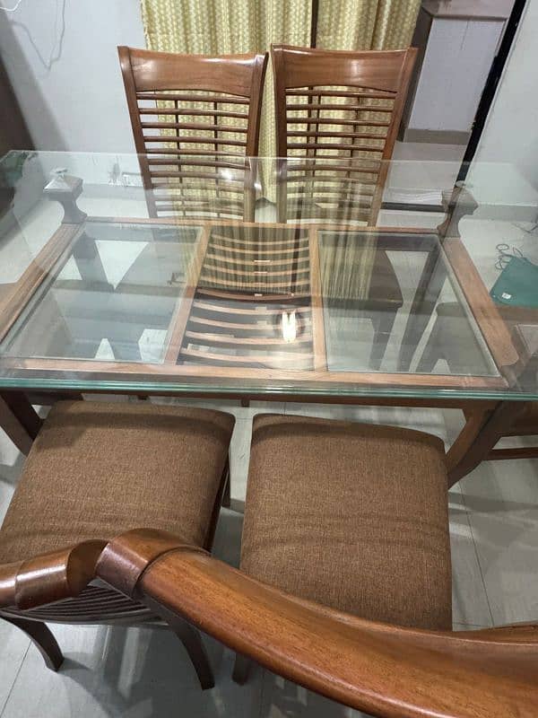 a Square 6  chair Dining Table Made up of Wood and Glass 4