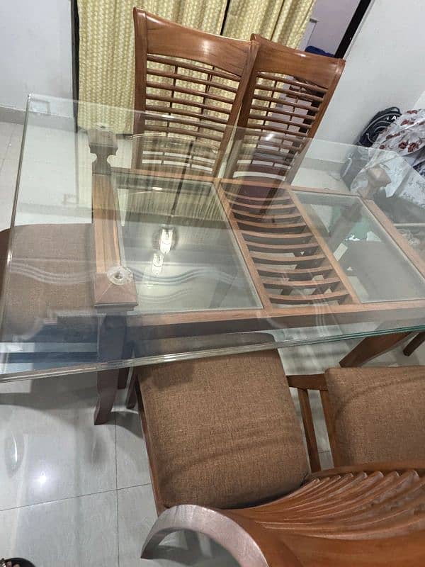 a Square 6  chair Dining Table Made up of Wood and Glass 6