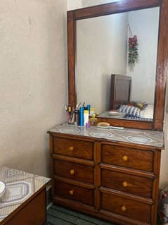 king size double bed with one side table and dressing table