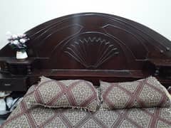 Double bed with attached side tables