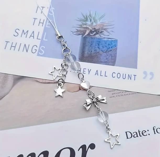 Cutest silver bows and stars phone charm !! 0