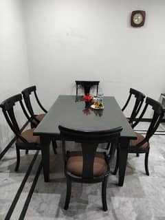 wooden dining table with 6 chairs