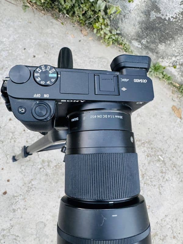 Sony alpha 6400 with kit lens and sigma 30mm lens and tripod 5