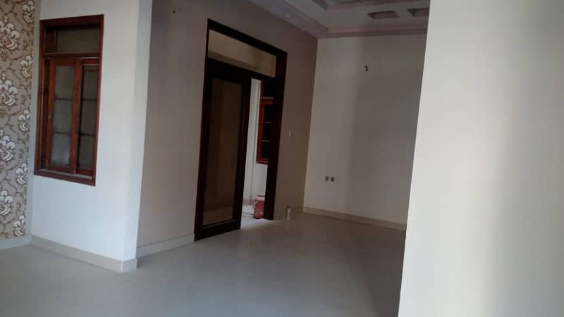 Like new 120yd 4bed dd 2 kitchen double story bungalow boundary wall near block7 jauhar 5