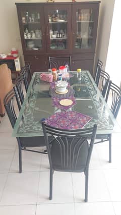 8 Seater Rod Iron Dinning Table with Glass top.