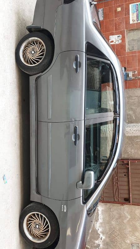 Suzuki Liana 2010 Model Lahore Registered total Genuine just sides 1