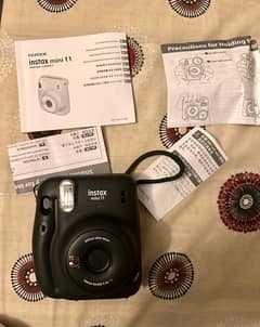 Unused fujifilm instax mini 11 camera with box